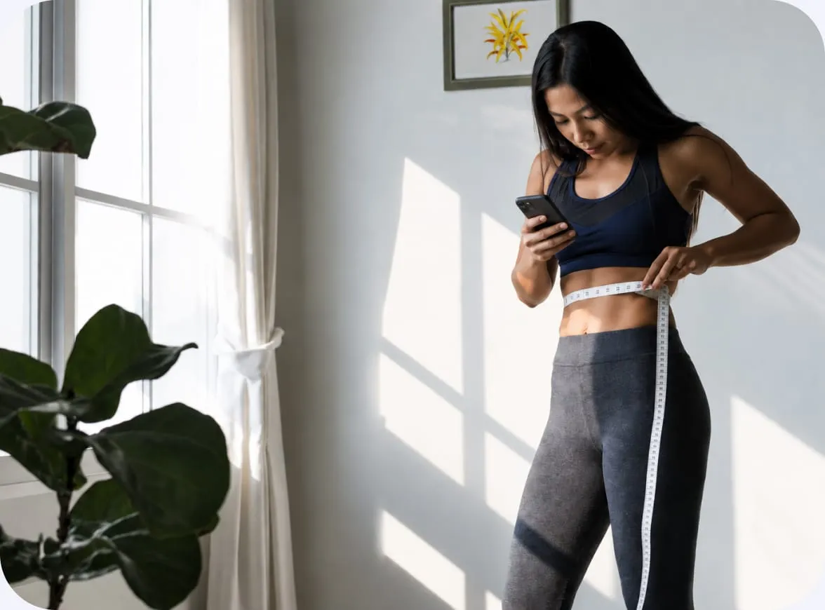 Woman using fitness app at home